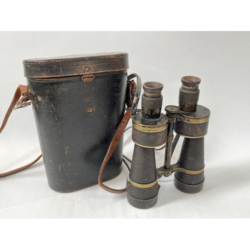 9076 - A pair of Imperial German 7xL50 marine binoculars by Leitz, serial number 6870, together with black ... 