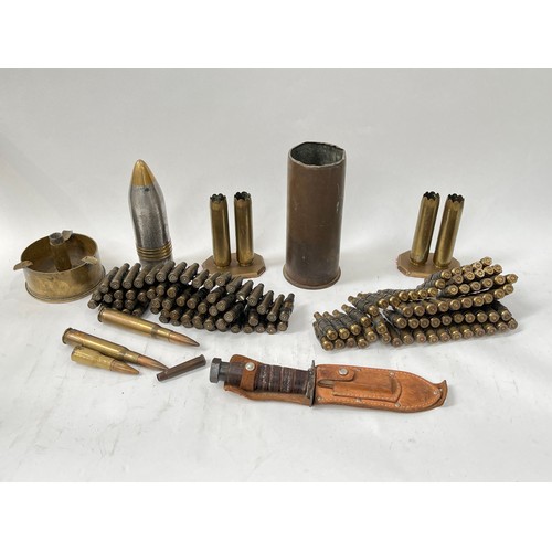 9079 - A box of miscellaneous including L42A1 belt, US fighting knife and shell case ash tray etc