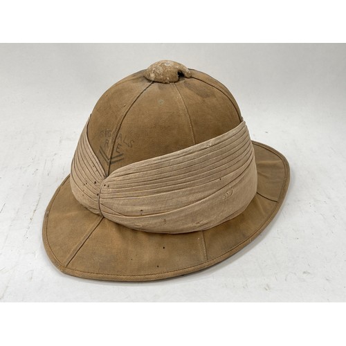 9114 - A WWI pith helmet, canvas covered, circa 1916, with SIGNALS RE lettering to front, Hobson & Sons