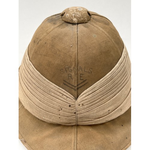 9114 - A WWI pith helmet, canvas covered, circa 1916, with SIGNALS RE lettering to front, Hobson & Sons