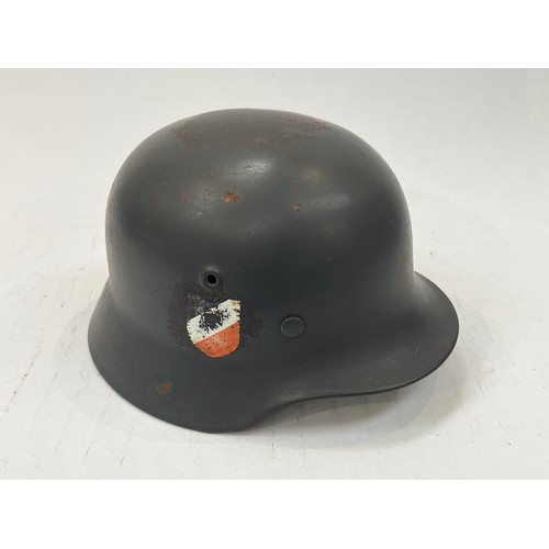 9123 - A reproduction German Luftwaffe double decal helmet with lining     (C)