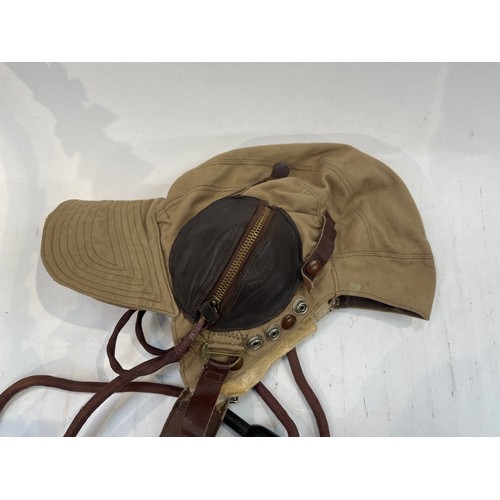 9124 - A Fleet Air Arm Flying helmet, canvas and leather, some moth damage, another slightly later model, l... 