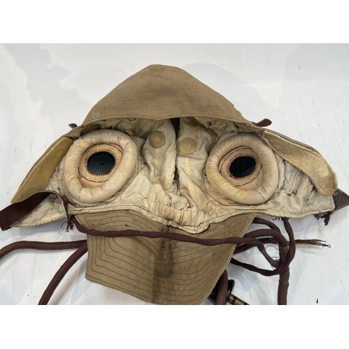 9124 - A Fleet Air Arm Flying helmet, canvas and leather, some moth damage, another slightly later model, l... 