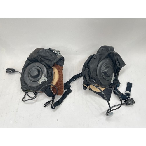 9125 - Two Soviet Russian pilot's helmets, black leather with rubber fittings, dated 1987 and 1991