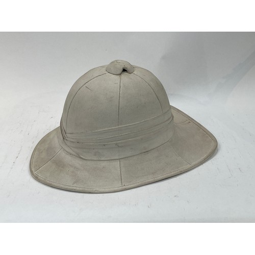 9131 - A WWII British Pith Helmet, dated 1942 and maker marked 'Failsworth Hats Ltd'