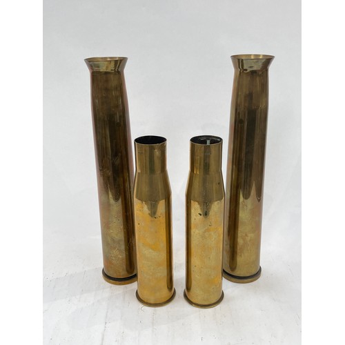 9139 - Two WWII 40mm Bofors shells, dated 1944 and 1943, tops flared, together with two WWII 37mm M16 anti-... 