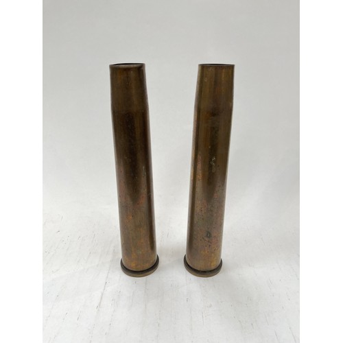 9140 - Two WWII brass shell cases consisting of M23A2 anti-tank 57mm, dated 1943, stamped LS-1-95 43 M23A2,... 