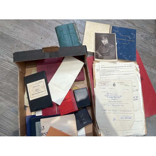 9160 - A quantity of WWII officer's ephemera including service documents, photographs, manuals etc, all rel... 