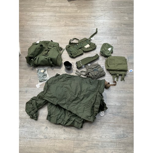 9171 - A quantity of miscellaneous militaria kit including webbing, rain cape, kidney pouches etc