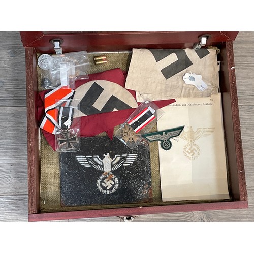 9172 - WITHDRAWN A display case of mixed reproduction Third Reich German items including medals, flag, penn... 