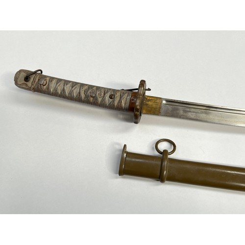 9193 - A WWII Japanese NCO's sword, green painted metal scabbard, the blade number non-matching to scabbard... 