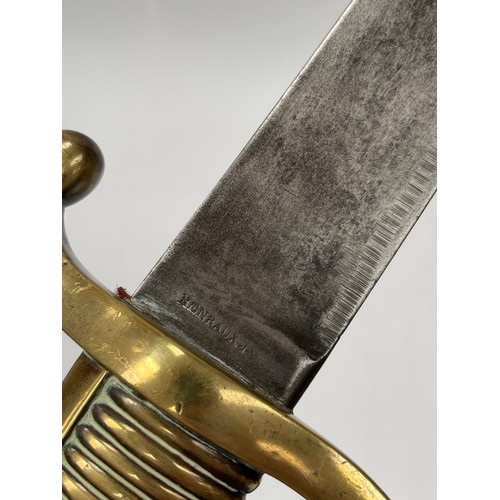 9212 - A 19th Century French Infantry briquet sidearm of cutlass form, brass ribbed hilt with D-shaped knuc... 