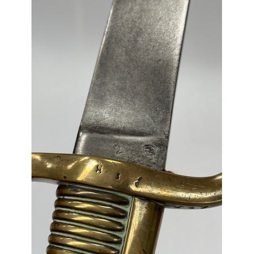 9212 - A 19th Century French Infantry briquet sidearm of cutlass form, brass ribbed hilt with D-shaped knuc... 