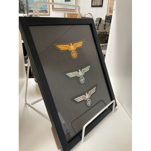 9282 - A framed collection of reproduction German NCO breast eagles    (C)