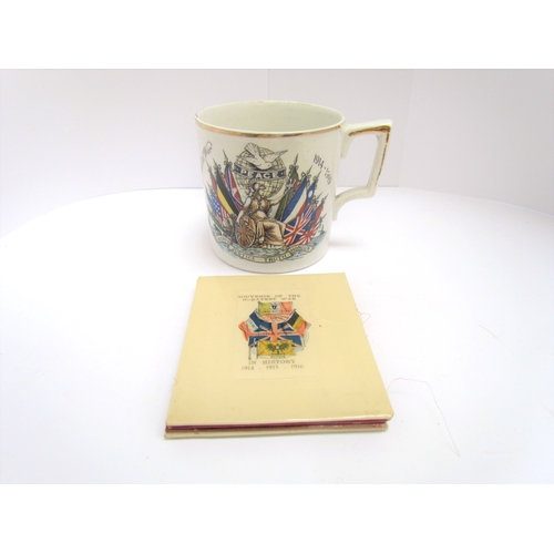 9420 - A WWI 'Peace 1914-1919' souvenir mug together with a Great War 1916 Celluloid document / photograph ... 