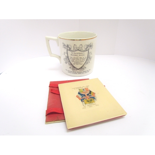 9420 - A WWI 'Peace 1914-1919' souvenir mug together with a Great War 1916 Celluloid document / photograph ... 