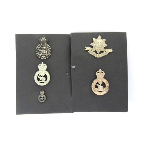 9422 - Five various colonial police badges: Burma cap badge, Gold Coast cap badge, two Sierra Leone badges ... 