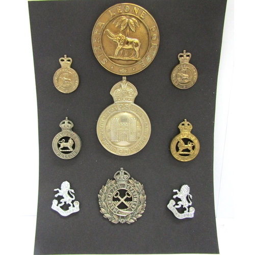 A collection of colonial police badges including Sierra leone Police ...