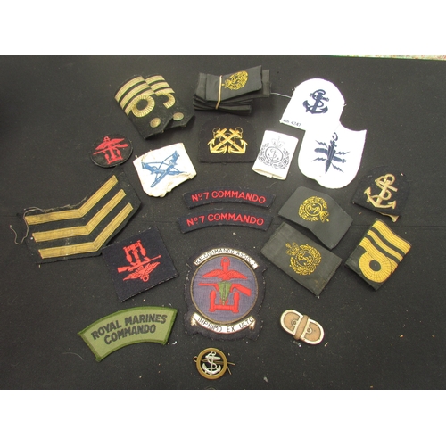 9459 - A collection of military insignia cloth badges including RN Commando Combined Operations and No. 7 C... 