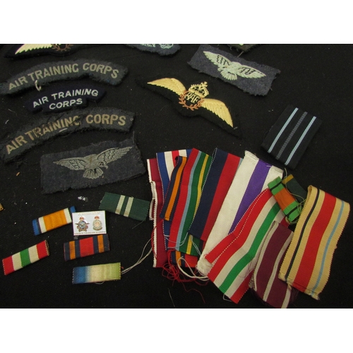 9461 - A collection of RAF badges / insignia including Air Training Corps, ribbons and wings etc