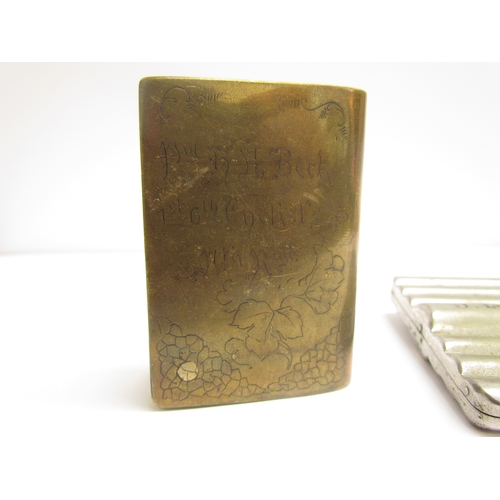 9468 - A WWI trench art brass cigarette lighter in the form of a miniature book, the fore edge opening out ... 