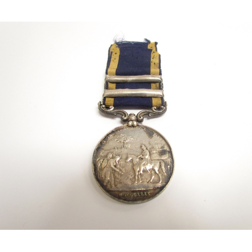 9470 - A Victorian Punjab Medal (1849), the obverse with Wyon profile of Queen Victoria, the reverse depict... 