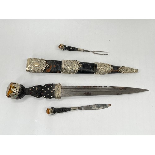 9222 - A piper's dirk by Lawrie of Glasgow, carved basket-weave handle, the pommel with artificial gemstone... 