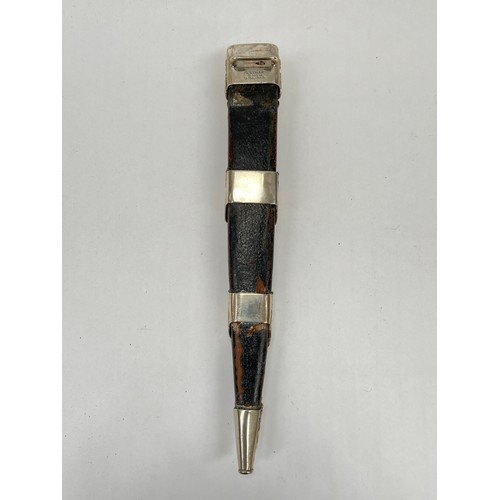 9222 - A piper's dirk by Lawrie of Glasgow, carved basket-weave handle, the pommel with artificial gemstone... 