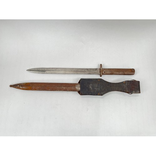 9226 - A WWI German Ersatz (Emergency) Mauser bayonet with scabbard and black leather belt frog, corroded