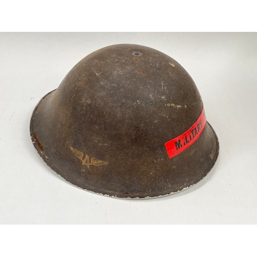 9274 - A 1944 pattern British helmet with winged A to side and later MILITARY POLICE label to front, with l... 