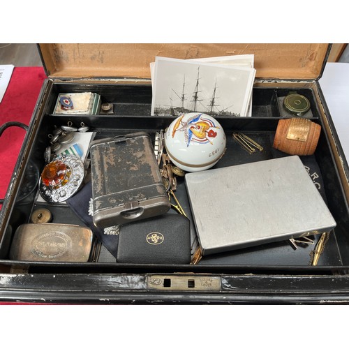 9493 - A tin of miscellaneous items including HMS Ganges teak barrel, vintage binoculars and insignia