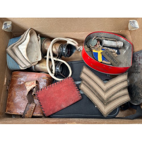 9493 - A tin of miscellaneous items including HMS Ganges teak barrel, vintage binoculars and insignia