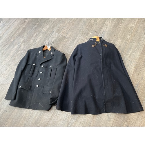 9497 - A 1940’s/50’s police cloak with lion’s head brass fastenings and collars numbered 1255, together wit... 