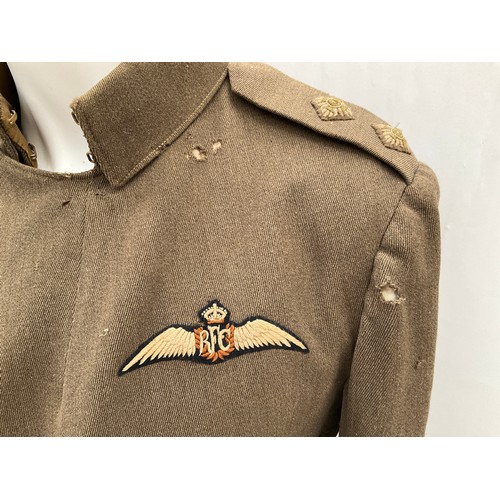 9515 - A WWI British Royal Flying Corps officer's 'Maternity' tunic, with RFC cloth badge to breast, some m... 