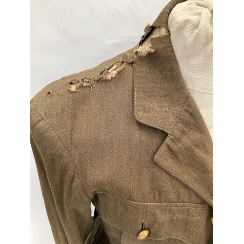 9515 - A WWI British Royal Flying Corps officer's 'Maternity' tunic, with RFC cloth badge to breast, some m... 