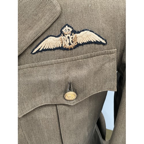 9515 - A WWI British Royal Flying Corps officer's 'Maternity' tunic, with RFC cloth badge to breast, some m... 