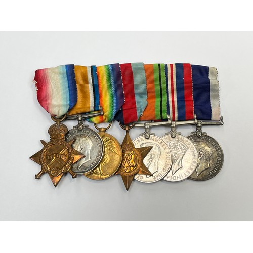 9511 - A WWI and WWII medal group of seven consisting of WWI 1915 star trio, WWII 1939-45 star, War Medal a... 