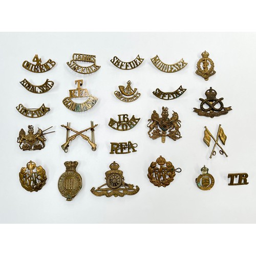 9512 - A collection of British army insignia, mainly shoulder titles, including Suffolk and Royal Scots. A ... 