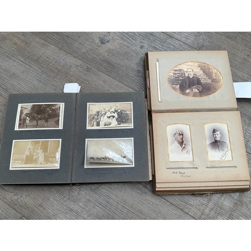 9285 - Two vintage photograph albums one including family portraits, the other relating to military life in... 