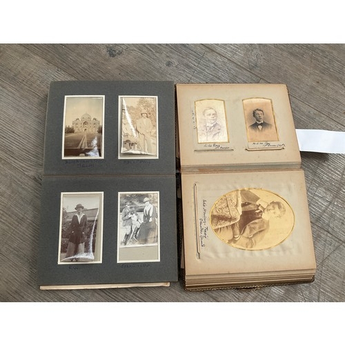 9285 - Two vintage photograph albums one including family portraits, the other relating to military life in... 