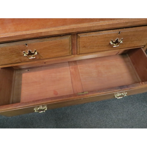 1055 - A circa 1900 walnut chest of two short over two long drawers, brass handles, plinth base, 82cm high ... 