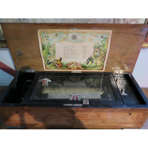 1001 - A 19th Century Swiss cylinder music box playing 10 airs, comb intact, the walnut case with painted d... 