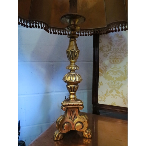 1006 - An 18th Century style gilt table lamp base on paw feet with shade