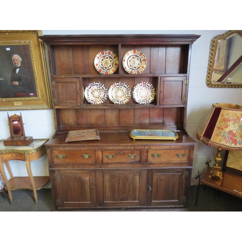 1009 - An early 19th Century stained oak dresser with three drawers and cupboards to the base and a board-b... 