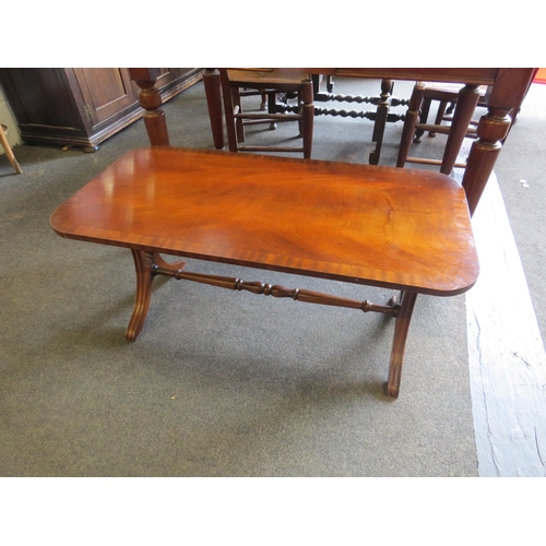 1023 - A reproduction mahogany coffee table, 42cm high x 90cm long x 45cm wide