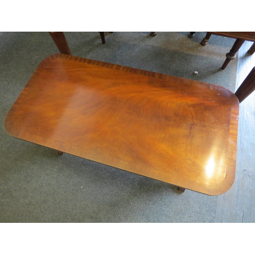 1023 - A reproduction mahogany coffee table, 42cm high x 90cm long x 45cm wide