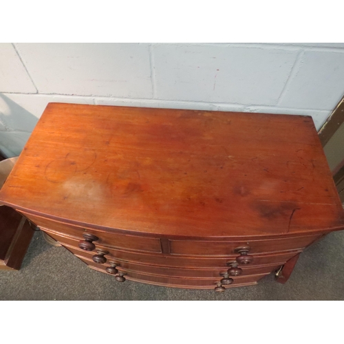 1047 - An early 19th Century mahogany bow front chest of two short over three long drawers, with turned woo... 