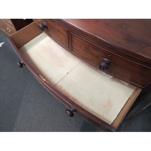 1047 - An early 19th Century mahogany bow front chest of two short over three long drawers, with turned woo... 