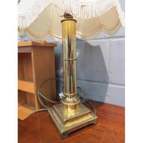 1060 - A brass column form table lamp with pleated shade