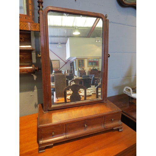 1098 - A 19th Century mahogany swing toilet mirror in the 18th Century style, with three small jewellery dr... 